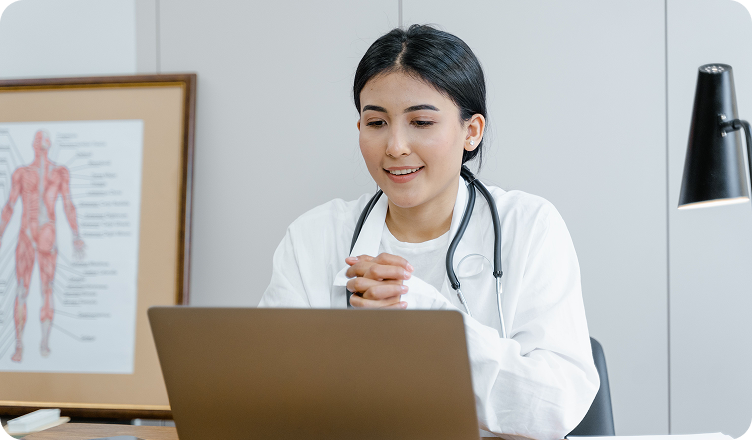 Doctor consulting patient via laptop