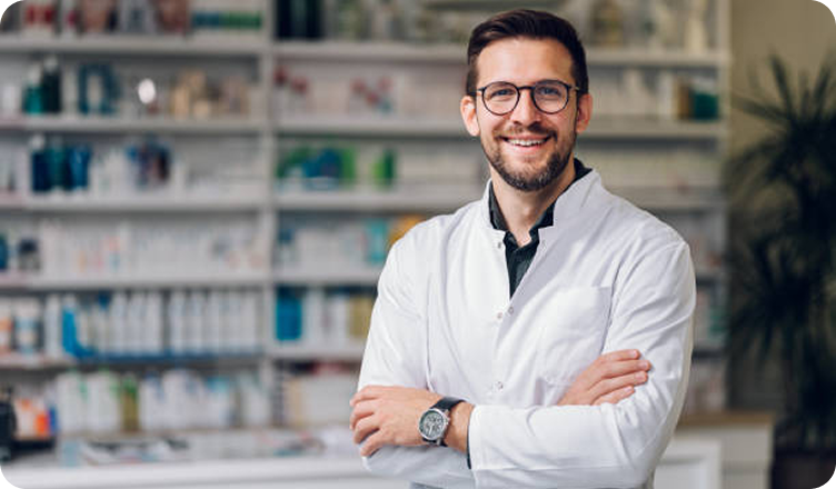Smiling pharmacy owner wearing glasses